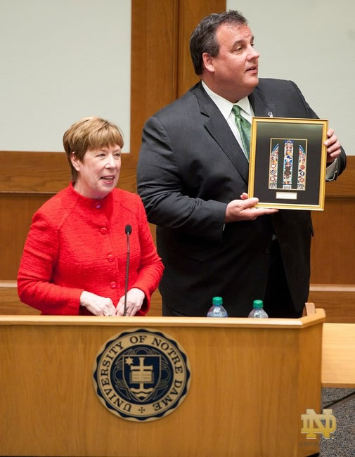 New Jersey Gov Chris Christie displays a gift from Dean Nell Jessup Newton